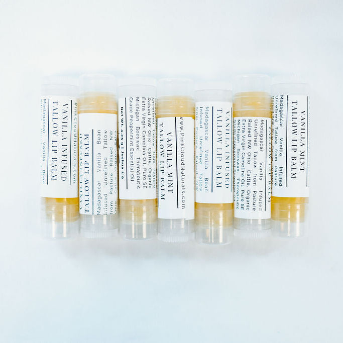 Set of lip balm tubes with labels on a white background